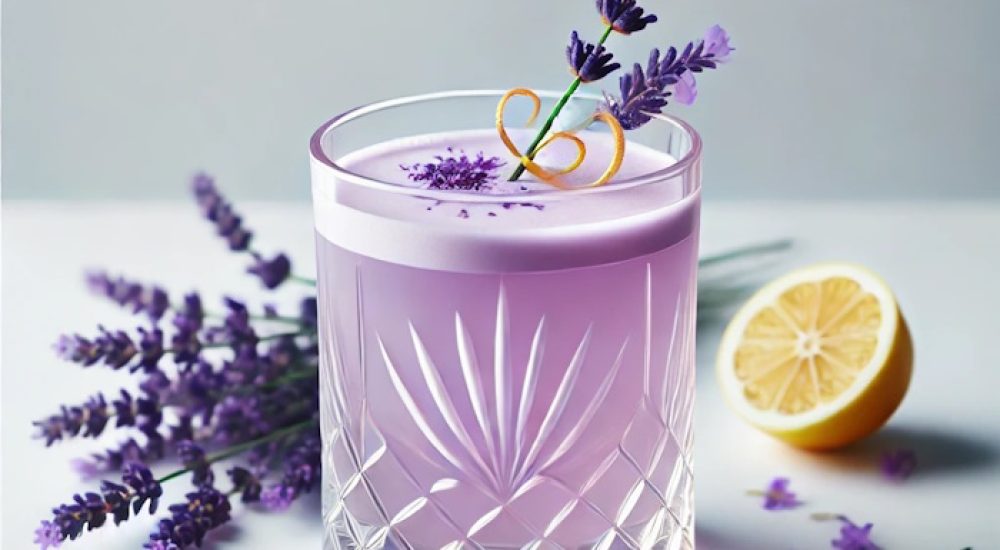 DALL·E 2025-01-16 11.15.33 - A lavender-inspired cocktail served in a crystal glass, featuring a pale purple hue and garnished with a small lavender sprig and a twist of lemon zes